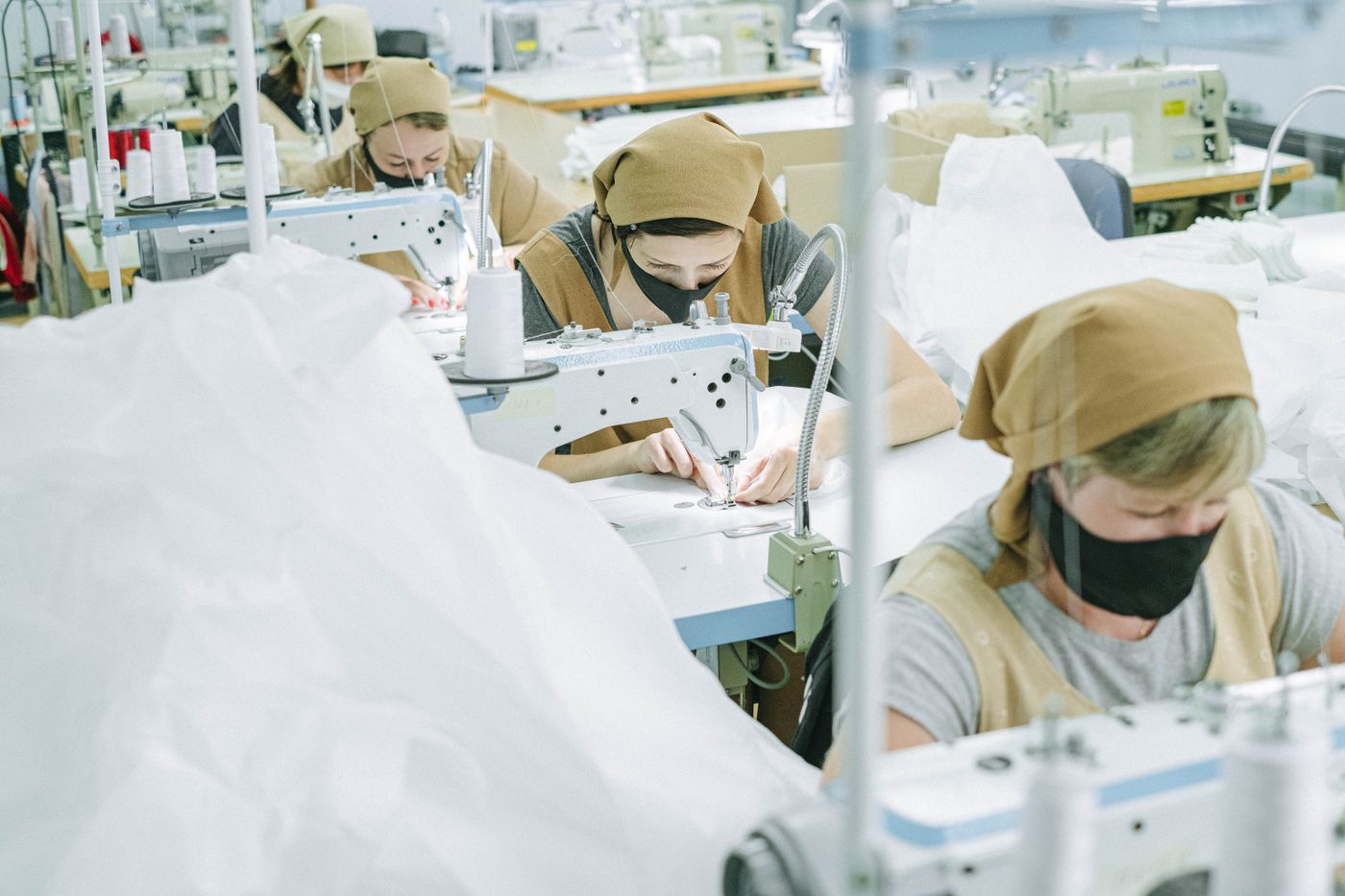 Industry reference: garment workers sewing, not the AAS factory